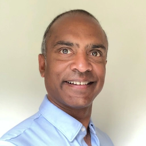 A close up of a person wearing a blue shirt.